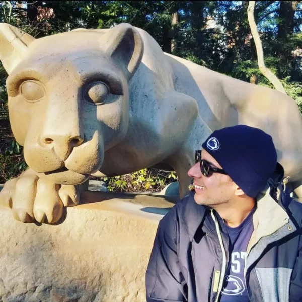 Bob Garcia beside the Penn State Nittany Lion statue